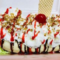 Banana Split · Banana sliced in half, served with three ice cream scoops (your choice), topped with strawbe...