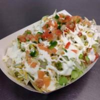 Frito Pie · Frito corn chips topped with nacho cheese, beans, lettuce, shredded cheddar/jack cheese, sou...