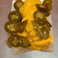 Nachos · Tortilla chips prepared with nacho cheese and any choice of your add ins.

Tortilla de Nacho...