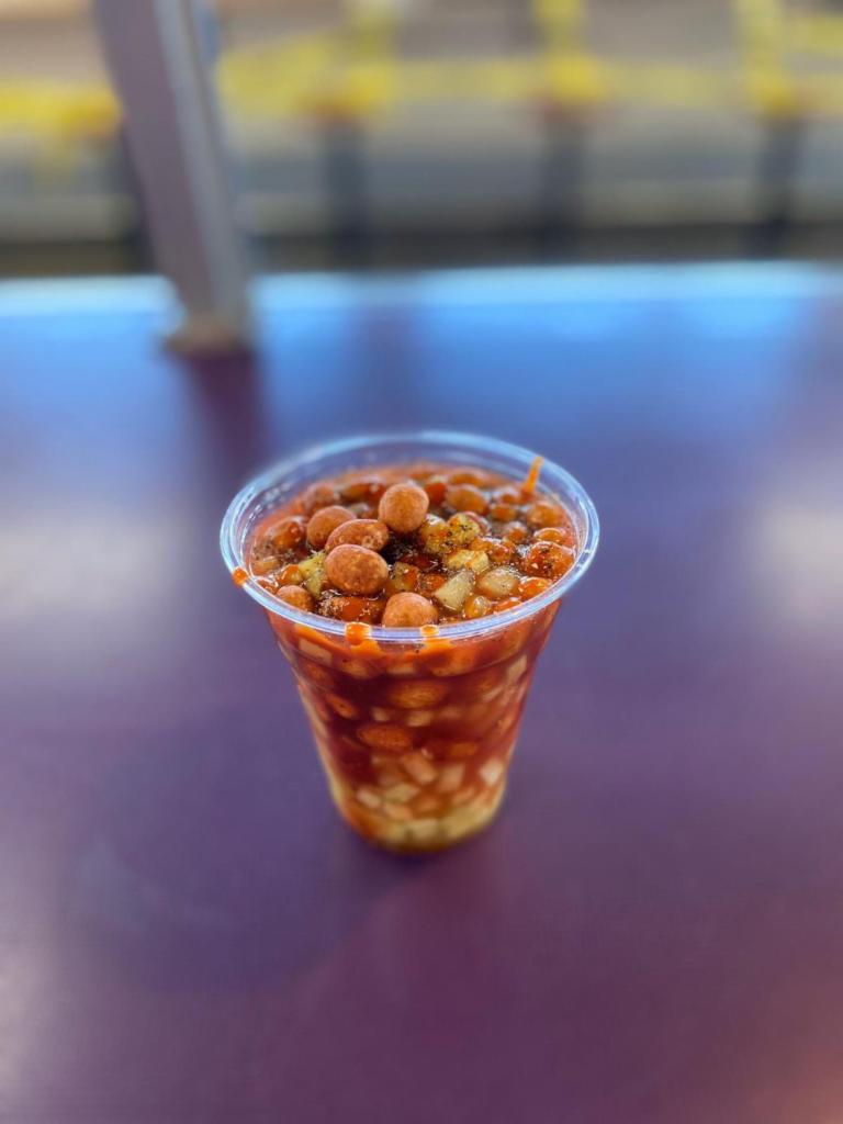 Cacahuates Preparados · Japanese Peanuts prepared with diced cucumbers prepared with Clamato and mixed with spices, Lime juice and Valentina hot sauce swell as soy sauce.
Cacahuates  Japoneses preparados con pepinos cortados y Clamato con especies , jugo de limón salsa Valentina y salsa soya