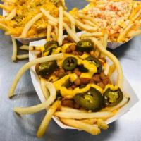 Green Chili Cheese Fries Con Elote · Fries with green chile, nacho cheese and shredded cheese and elote on top.

Papas fritas con...