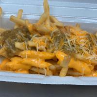 Green Chili Cheese Fries · Fries with green chile, nacho cheese and shredded cheese.
Papas fritas con salsa verde queso...