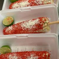 Elote Entero con Hot Chetos · Corn on the cob with a mayo base and covered in hot cheetos! with cotija cheese on top and a...