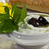 Tzatziki · Finely chopped baby cucumber blended with garlic, yogurt, dill and mint.