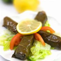 Stuffed Grape Leaves · Grape leaves stuffed with rice, pine nuts, currants and herbs.