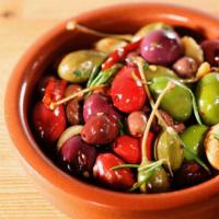 Mixed Olives · Combination of Mediterranean olives mixed with lemon juice, garlic, oregano, chili flakes an...