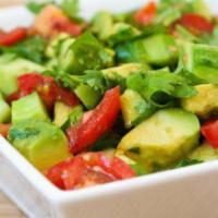 Avocado and Tomato Salad · Fresh tomato, cucumber, red onion, avocado, corn and fresh parsley. Tossed with olive oil an...