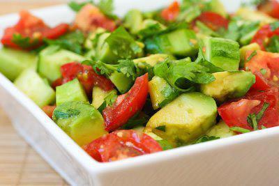 Avocado and Tomato Salad · Fresh tomato, cucumber, red onion, avocado, corn and fresh parsley. Tossed with olive oil and lemon juice.