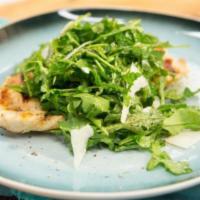 Chicken Paillard · Grilled chicken breast with arugula, tomato, red onion tossed with olive oil, vinegar and le...