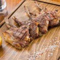 Lamb Chops · 4 pieces. Best  Lamb chops with chef's special herbs. Served with rice.