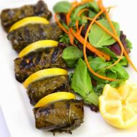 Salmon in Vine Leaves · Fresh vine leaves stuffed with chunks of marinated salmon char-grilled and served with house...