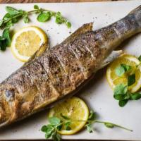 Mediterranean Seabass · Char-grilled whole seabass, served with house salad.