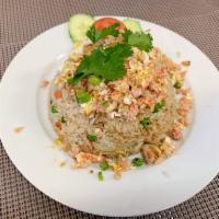 Crab Fried Rice · Egg, onion, pea, carrot, scallion and crab meat on top.