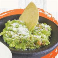 Handcafted Guacamole · Chunky avocado mixed with pico de gallo and fresh lime.