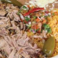 Carnitas Dinner · Mexican style, slow cooked braised pork. Served with Mexican rice, beans and pico de gallo.
