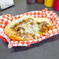 17. Small Mushroom Onion Cheesesteak Sandwich · Seasoned beef rib steak, mushrooms, onions, and melted white American cheese on a soft Itali...
