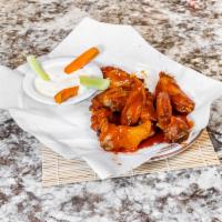 4. Buffalo Wings · Cooked wing of a chicken coated in sauce or seasoning. 10 pieces. Buffalo sauce on request.