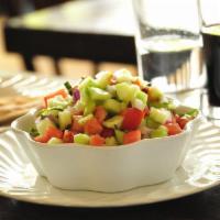 Salad Shirazi · Diced tomatoes, cucumbers, red onions, and mint tossed in fresh lime juice and olive oil.