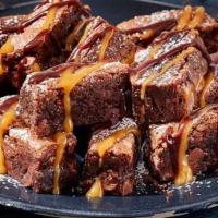 Brownie Bites · Enjoy these decadent walnut brownie bites filled with toffee morsels and dusted with powdere...