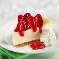 Strawberry Cheesecake · One of our Seasonal Favorites! Creamy cheesecake topped with fresh strawberries in a sauce, ...