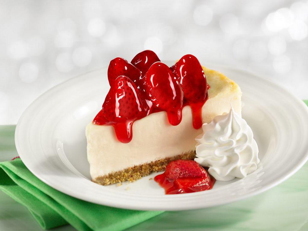 Strawberry Cheesecake · One of our Seasonal Favorites! Creamy cheesecake topped with fresh strawberries in a sauce, served with whipped cream.
