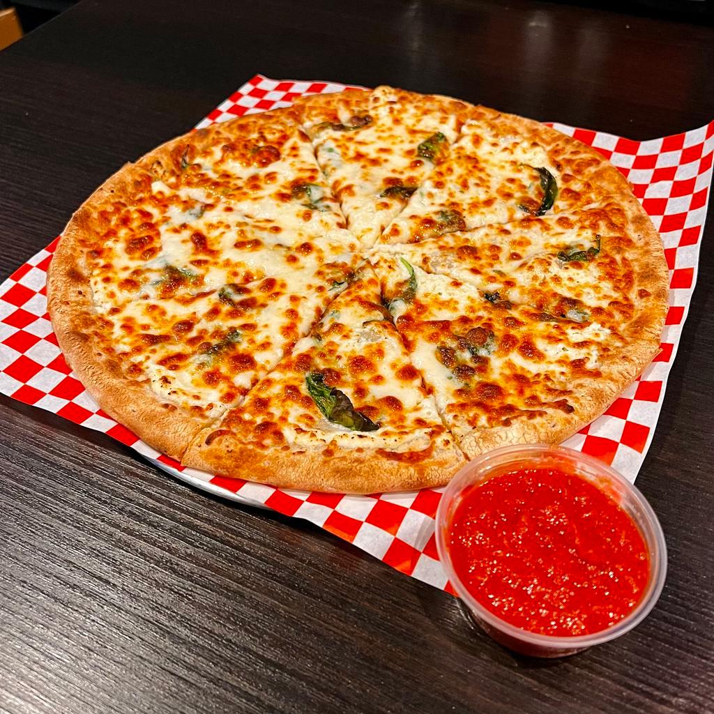 Ricotta White Pizza · Ricotta cheese & olive oil base with basil and Parmesan. Served with a side of homemade tomato sauce.