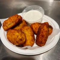 Jalapeño Poppers · Six (6) crispy stuffed jalapeños served with a side of ranch dipping sauce.