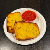Garlic Bread · Two pieces with garlic butter spread served with marinara dipping sauce