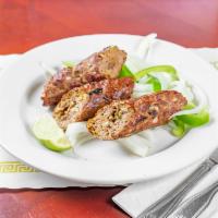 Gilafi Seekh Kabab · Minced lamb smoked with cloves.