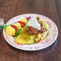 Barbacoa Omelette  · Roasted sweet corn, hatch chiles, tomatoes, onions, sour cream, and tomatillo sauce.