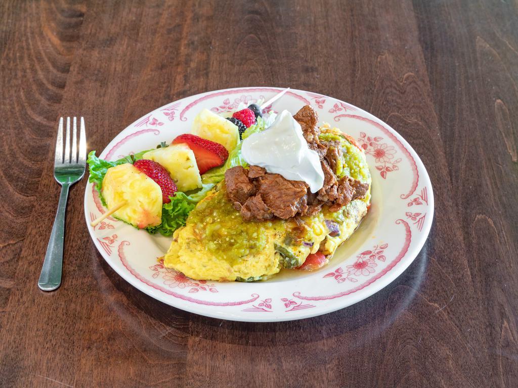 Barbacoa Omelette  · Roasted sweet corn, hatch chiles, tomatoes, onions, sour cream, and tomatillo sauce.