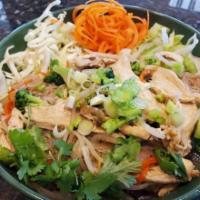 Pad Se Ew · Rice noodle tossed in with a fried egg in brown sauce, served with chicken, carrots, broccol...