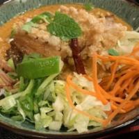 Mee Kar Thee · Peanut noodle bowl. Rice noodle bowl in a spicy creamy egg coconut and peanut sauce, julienn...
