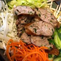 Lao Sausage · Lao herbal lemongrass sausage served with bean sprout, cabbage, lettuce, carrots, steam bok ...