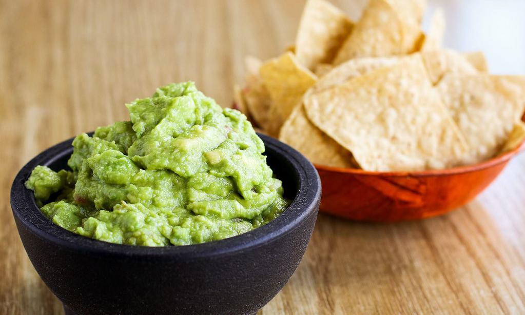 Guacamole · Fresh avocado, pico de gallo, lime and salted to perfection. Gluten-free, vegan. Yellow corn chips included