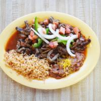Ranchero Steak Platter · Includes refried beans, rice, pico de gallo and tortillas.