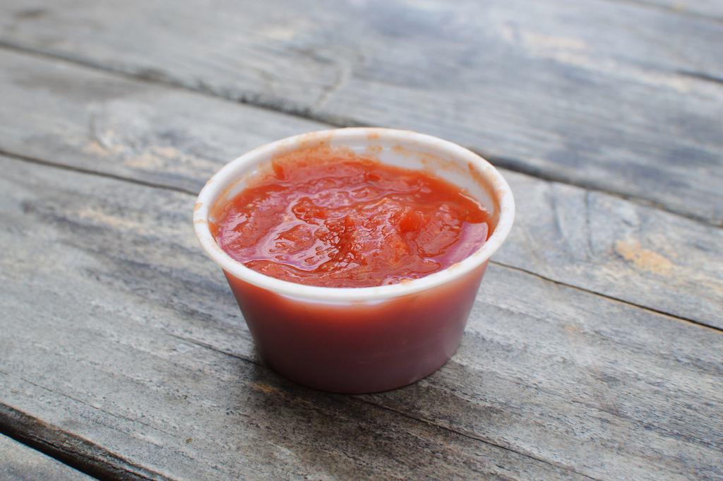 Side of Red Sauce · 2 oz cup of our house-made red sauce. Garlic, oregano, and some chili flake. 
