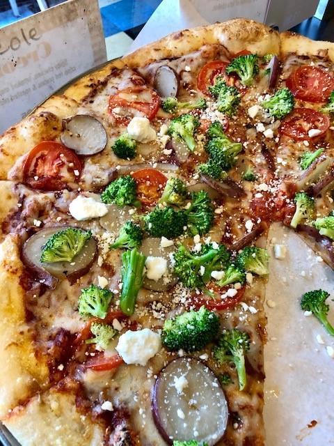 Rustic Pie Pizza · Baby red potatoes, Roma tomatoes, garlic, broccoli and a sprinkle of feta cheese.