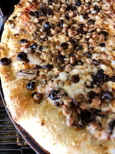 Combo Classico Pizza · Mounds of mushrooms, black olives and crumbled Italian sausage.