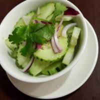 Cucumber Salad · Thai style sliced fresh cucumber and onions in homemade dressing.