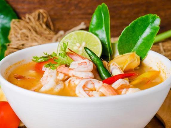 Shrimp Tom Yam Soup · A traditional hot and sour Thai soup made with our delicious lemongrass and galangal, kosher leaves,
tomatoes in our homemade broth garnished with mushrooms and cilantro. Spicy.