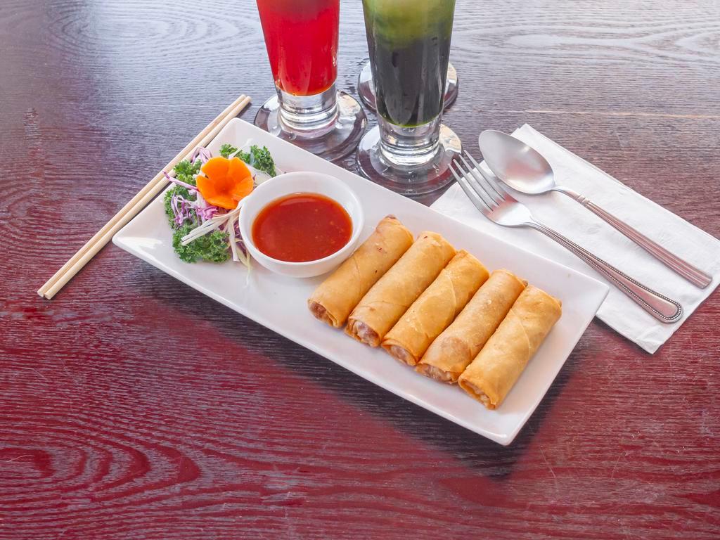 2. Spring Rolls · Deep-fried rolls stuffed with silver noodles, carrots, and cabbages. Served with sweet and sour sauce.