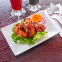 8. Chicken Wings · Deep-fried chicken wings glazed with sweet and sour sauce.