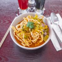 Khao Soi · Try our *NEW* Northern Thai style Curry Noodle Soup. Contains : Noodles, Pickled greens, Bea...