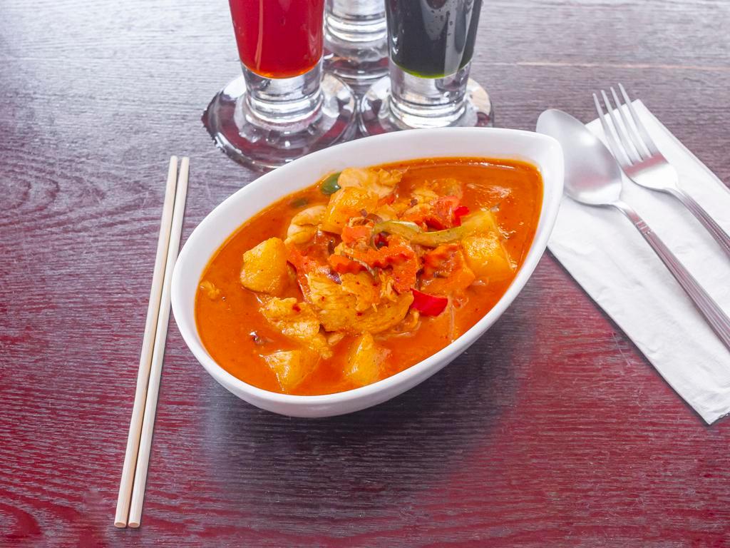  Red Curry · Red curry with bamboo shoots, bell peppers, basil leaves, and coconut milk. Served with jasmine rice. Spicy.