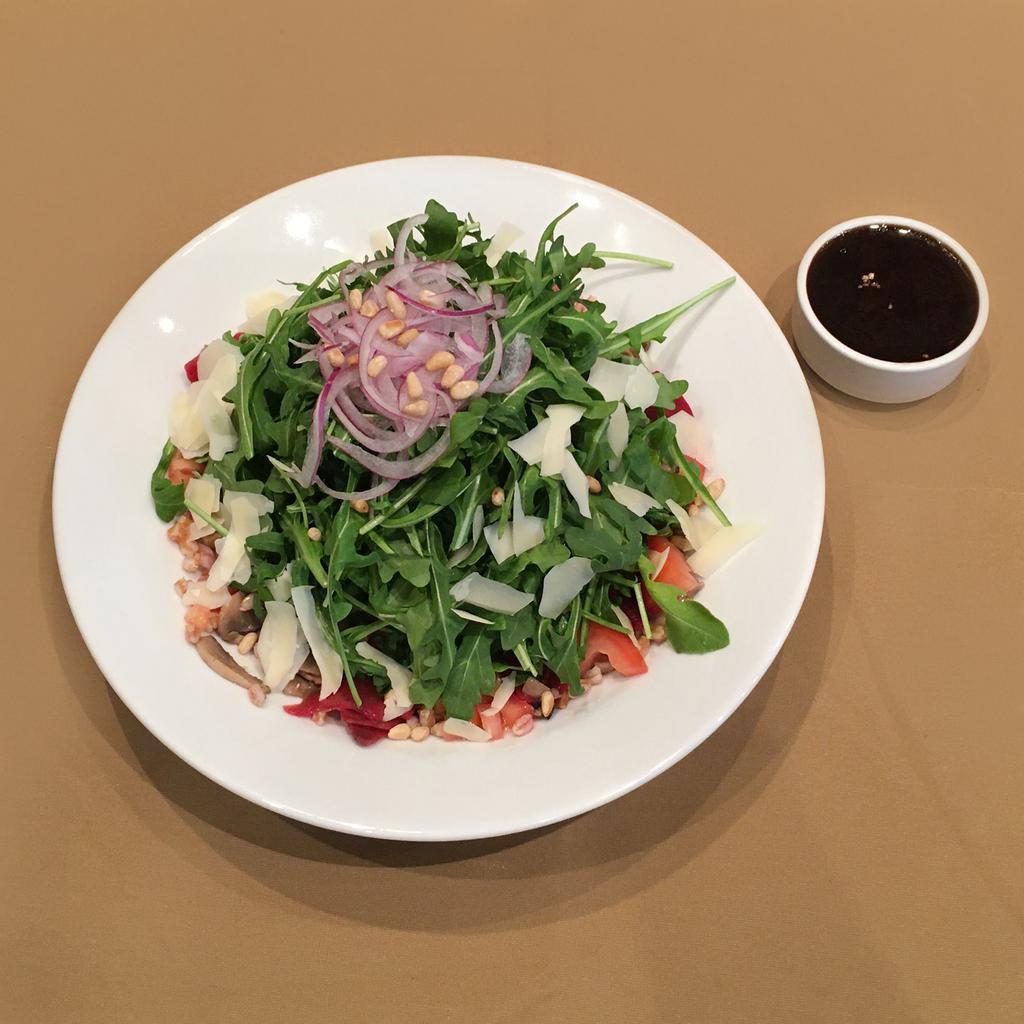 Arugula & Farro Salad · Sauteed mushrooms, red beets, red onions, toasted pine nuts, and parmesan cheese with a balsamic vinaigrette.