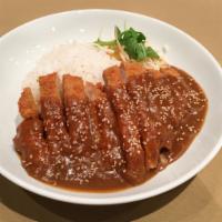 Donkatsu with Rice · Panko crusted pork cutlet with gravy sauce.