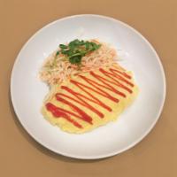 Omelette Rice · Korean style vegetable fried rice wrapped in a thin omelette.