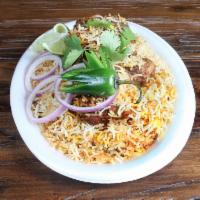 Mutton Dum Biryani · Stewed mutton with fresh mint and herbs, layered with rice and cooked to perfection.