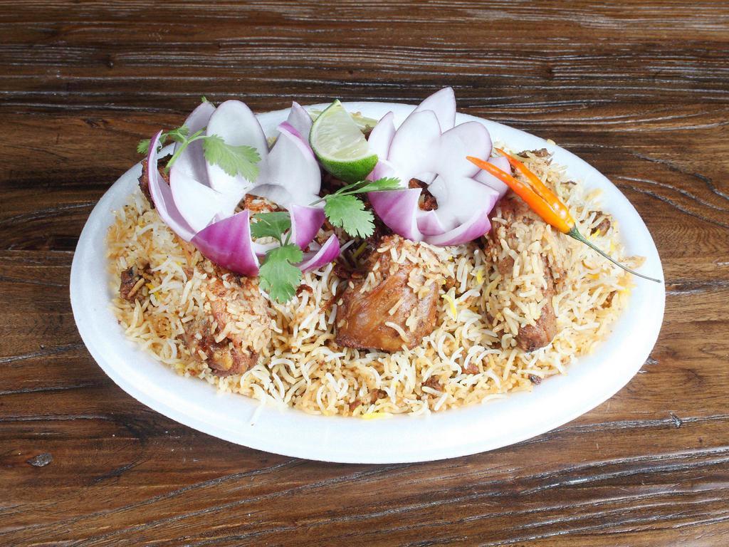Chicken Dum Biryani · Stewed chicken, with fresh mint and herbs, layered with rice and cooked to perfection.